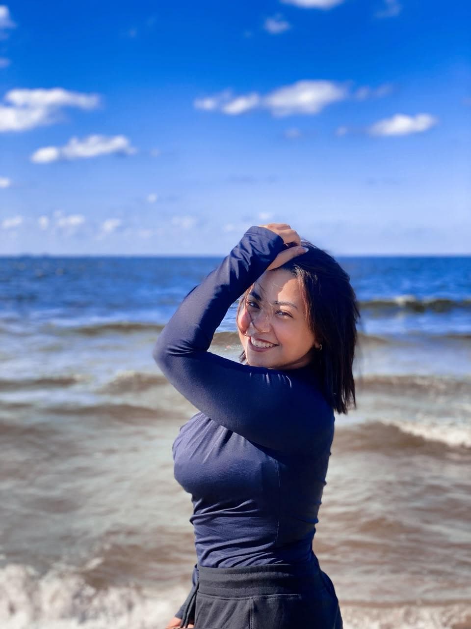 Shams Abdelwahab smiling by the sea